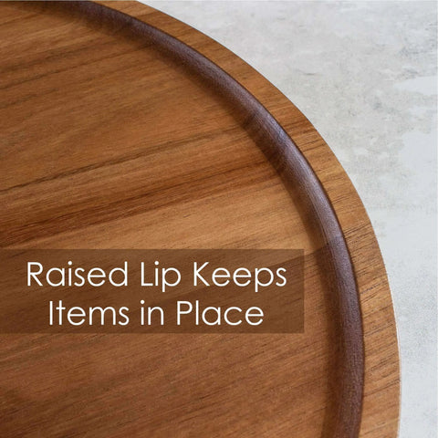 Close-up of Acacia wood lazy susan organizer designed for kitchen and pantry use, featuring a raised lip for stability.