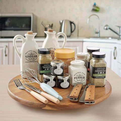18 inch acacia wood lazy susan cabinet organizer with spices and condiments on kitchen counter.