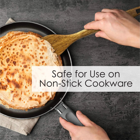 Person using spatula from 3 Piece Acacia Wood Kitchen Utensil Set With Spatula Slotted Spoon And Cooking Spoon For Flip Stir And Scoop In Nonstick Pans And Everyday Cooking Your Go To Tool For Home Chefs to flip crepe in nonstick pan.