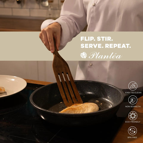 Person using Spurtle Kitchen Tools Wooden Set For Nonstick Cookware to stir food in a pan, showcasing heat resistance and non-scratch qualities.