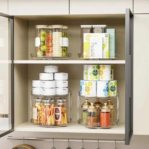 4 Pack 9.5 Inch Clear Acrylic Lazy Susan Turntable Organizer in kitchen cabinet with food items, showcasing two tiers.