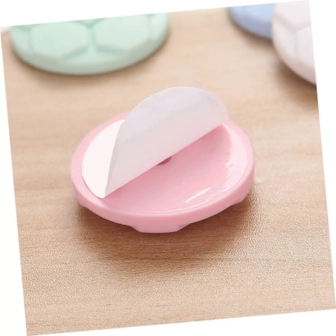 Close-up of a pink protective pad with adhesive backing, part of the Protective Pads For Washing Machine And Home Use 5 Pack.
