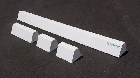 36-inch white PVC rooftop support beam with four white roof blocks on asphalt; ROOFTOP logo visible.