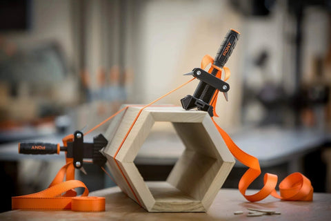 Adjustable Clamp Pony 1225 Rapid Acting Band Clamp With Non Marring 1x1 Inch Jaws For Irregular Shapes in use on hexagon wood piece