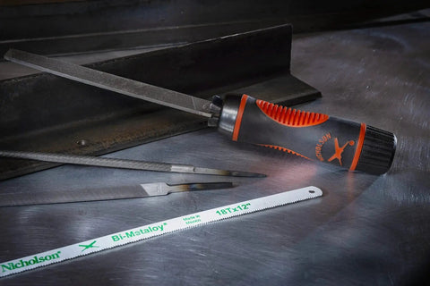 Adjustable universal file handle clamps to tool tang and fits multiple file sizes without inserts, showing file and saw blades