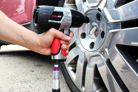 Using 44 Piece Pro Grade Air Tool Accessory Kit With Heavy Duty Impact Wrench Air Ratchet Die Grinder Blow Gun Air Hammer Dual Air Chuck Tire Gauge And Essential Accessories For Home Garage And Auto Shop to secure a car wheel