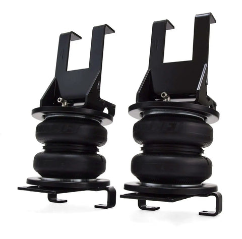 Premium air spring kit delivers up to 7500 lbs leveling, adjustable 5 to 100 psi, shown as two black air springs.