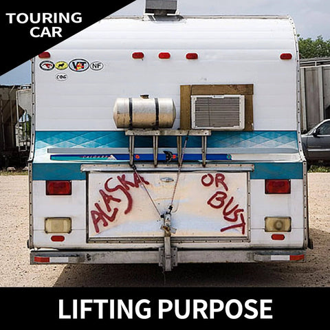 Back of a touring car with 'Alaska or Bust' sign, metal tank, and a mounted air conditioning unit.