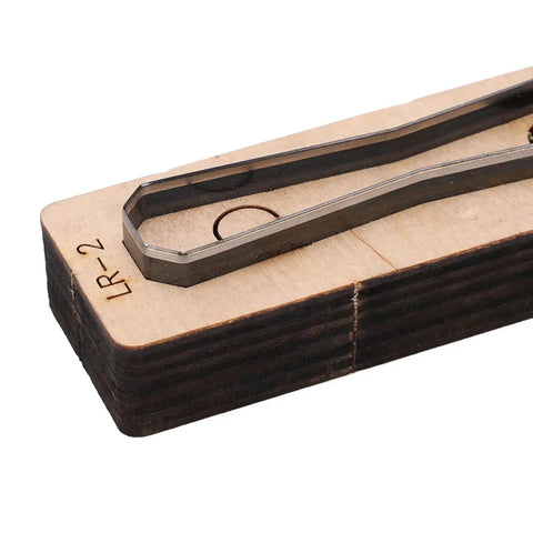 Durable Alloy Steel Leather Cutting Die Set for DIY Leather Craft Projects showing close-up of steel on wood base