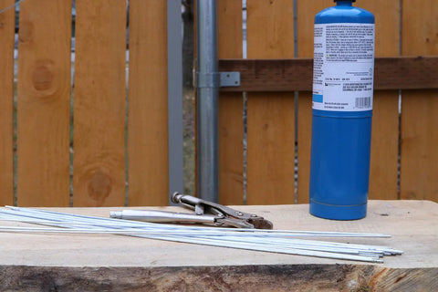 USA Made Aluminum Repair Brazing Rods Set by Alumaloy, 20 Rods, As Seen on TV, with torch and tools outdoors