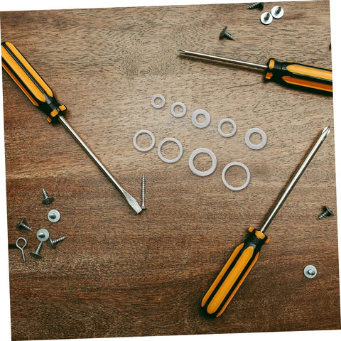 Screwdrivers and washers on a wooden surface. Must Have Aluminum Crush Seal Gasket Washers Set For Automotive And Industrial Use High Temperature