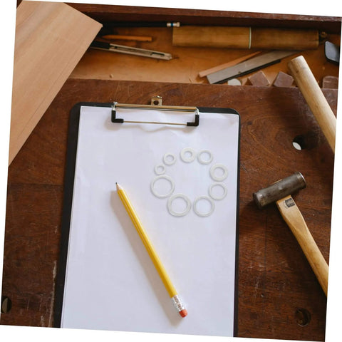 Aluminum All In One Leakproof Gasket Kit With 200 Pieces And Multi Size Crush Washers on clipboard with pencil and tools