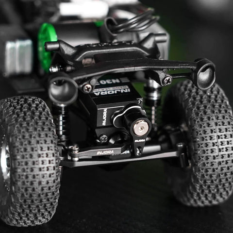 Aluminum N30 Nano Servo with Servo Saver for 1/30 Axial SCX30 installed on off-road RC vehicle close-up view