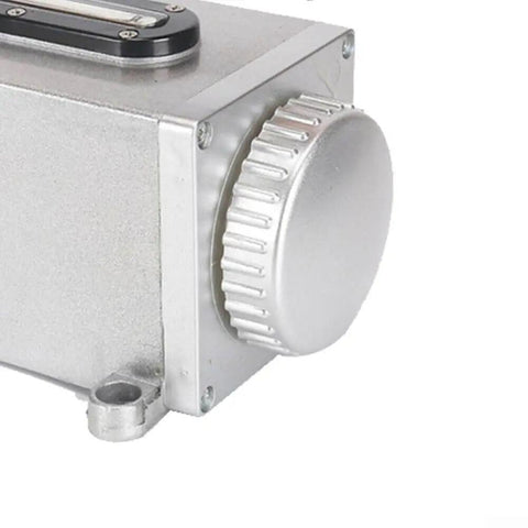 Close-up of heavy duty manual oil pump for CNC machines and milling lathes, showing the aluminum body and cap, 500cc capacity.