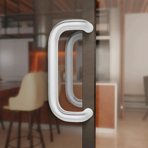 Offset Back To Back Aluminum Pull Handles with clear anodized finish on modern glass door.
