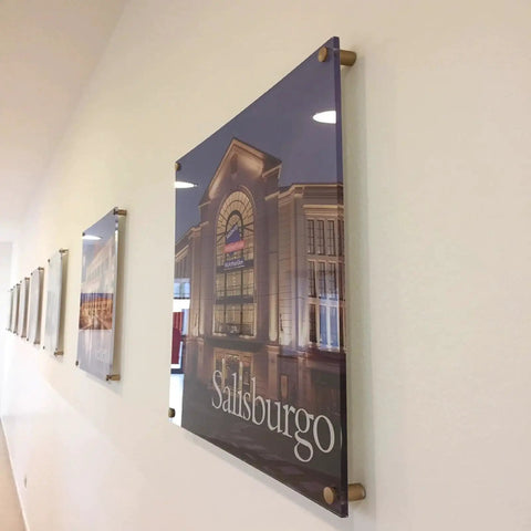 Acrylic sign wall-mounted with pack of 12 aluminum wall spacers and sign standoff screws delivering a clean, modern display.