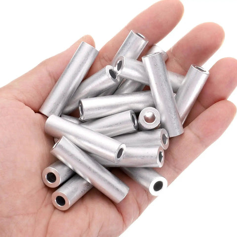 Hand holding Pro Grade Heavy Duty Aluminum Spacer Set for M5 Screws and Rods, 5mm bore, 10mm OD, 40mm length, 20 pieces, plain finish.