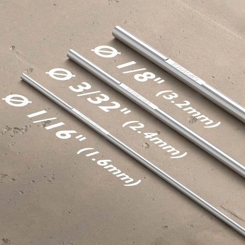 Different sizes of welding rods on concrete surface, highlighting ER4043 Aluminum TIG Welding Rod One Eighth Inch Diameter By Sixteen Inch Length Five Pound Pack For A Stable Arc With Low Spatter And Great Fluidity From High Silicon Content Welds Smooth With Argon Or Argon Helium Gas Pro Grade For Easy Aluminum Welds.