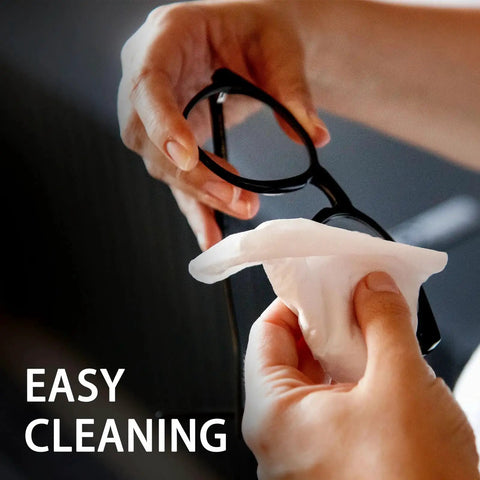 Hands using Anti Fog Glasses Wipes Pack 120 PreMoistened Lens Cleaner For Glasses Sunglasses on eyeglasses