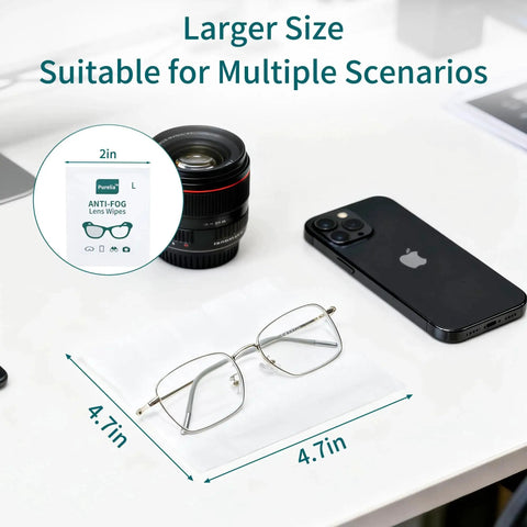 Large Anti-Fog Lens Wipes 12x12cm, 100 Count, Individually Wrapped for Glasses, shown with glasses and smartphone on desk