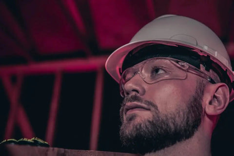 Worker wearing BearKat 3 Anti Fog Polycarbonate Safety Glasses With Non Slip Temples and hard hat on construction site