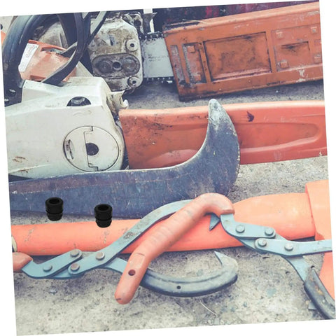 Chainsaw and tools with anti-vibration rubber mounts designed for 52 to 58cc gasoline chainsaws on concrete floor.