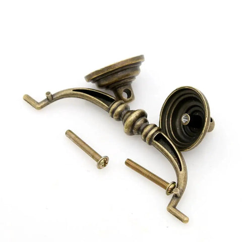 Four Piece Vintage Antique Brass Bail Pull Handle Set For Wooden Drawers Cabinets And Cupboards, shown with screws.