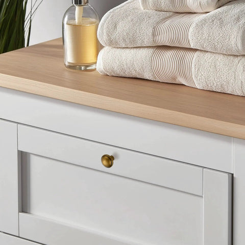 White dresser with 30 Pack Antique Brass Cabinet Knobs 1-1/4 Inch Diameter Round Solid Zinc Alloy Drawer Pulls.