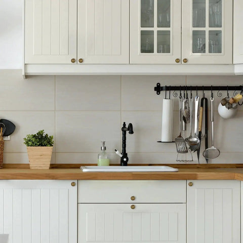 Antique Brass Cabinet Knobs 10 Pack For Kitchen Cabinets And Drawers installed in white kitchen shown on cabinet doors