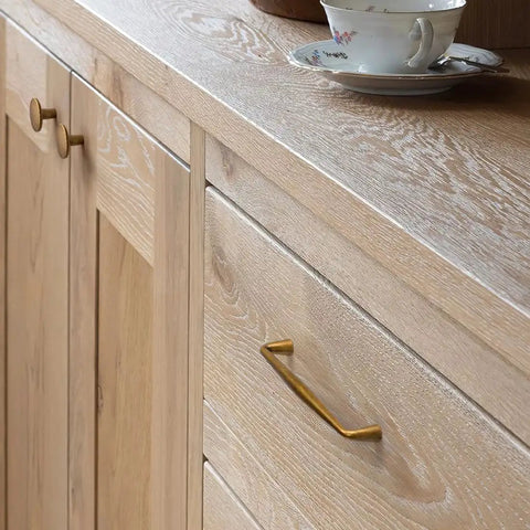 10 Pack Antique Brass Cabinet Pulls Three And Three Quarter Inch Center To Center Spacing shown on wooden dresser