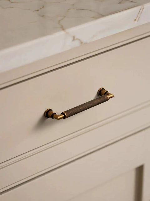 Antique Brass Cabinet Pulls Set Five Inch Center Knurled Vintage Drawer Pulls installed on a dresser for corrosion resistance