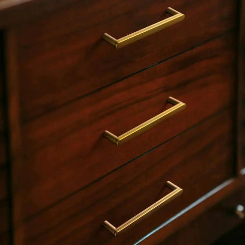 Antique Brass Cabinet Pulls Set Of 6, 5 Inch Center To Center, Minimalist Vintage Drawer Handles installed on wooden drawers.