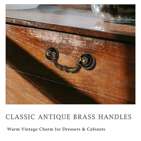 Front view of Classic Antique Brass Drawer Pull on a wooden dresser, part of a 6 Pack Antique Brass Drawer Pulls for furniture restoration.