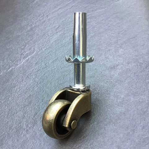 1 Inch Swivel Stem Ball Caster Wheel Zinc Alloy Antique Brass with Socket Mount 353 lb Capacity on gray surface