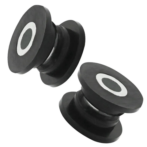 Two black bushing and sleeve components from Eight Piece Absorber Shock Bushing And Bearing Sleeve Kit For Arctic Cat ATVs.