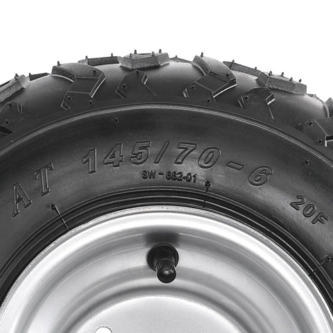 Close-up of Set Of 4 ATV Go Kart Tires 145/70-6 with 6 inch wheels, showing detailed tread and metal rim design.