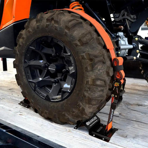 Wheel Chock Tie Down Kit With Rubber Grip Sleeve for Trailer E Track System securing an ATV tire, 1500lb load, close-up.