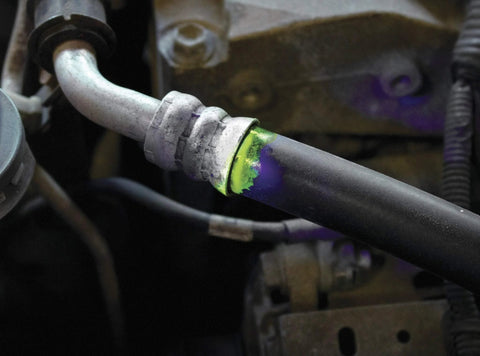 LeakFinder LF021 auto leak-detection kit; purple dye on metal hose fitting
