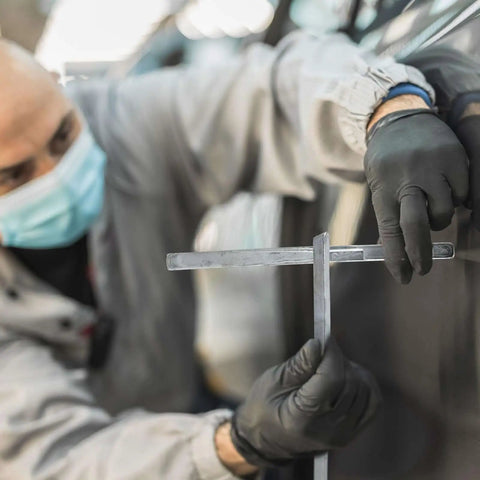 Mechanic using Lead Alloy Solder Rods For Car Body Repair 30 70 Tin Lead, Auto Brass Welding Sticks on vehicle panel