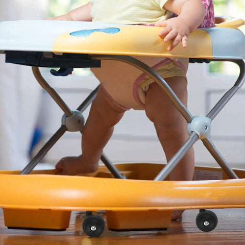 Replacement Baby Walker Wheels Set 4 Plastic Stroller Wheel Casters For Baby Trolley And Furniture Front And Back Fits 0.38 Inch Hole Diameter Tool Free Installation For Quiet Indoor And Outdoor Use installed on a baby walker in use.