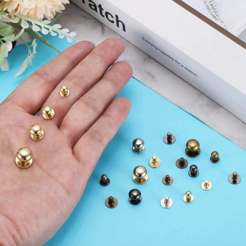 Hand showing Ball Head Stud Rivet Set 4 5 6 7 8 mm Head Diameter Back Screws 50 Pack Silver Tone Zinc Alloy Button Nipple Rivets
