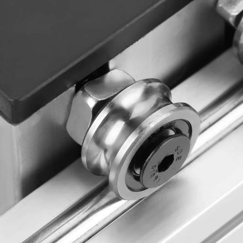Close-up of a roller bearing on the automatic ball screw linear CNC slide table with stepper motor, 100mm stroke aluminum actuator stage for industrial automation.