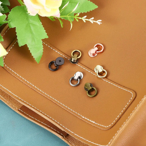Ball Stud Rivet Set For Purses And Leather Crafting, Four Pieces With D Ring Connector, on leather background, multiple colors