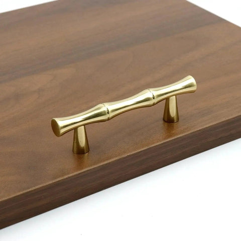 Gold brass retro antique finish bamboo-shaped cabinet handle on wood surface. Aluminum Alloy Bamboo Shape Cabinet Handles 2 Pack Drawer Pulls 3.7 Inch Length 2.5 Inch Center To Center Hole Distance For Cabinets Closets Dressers.