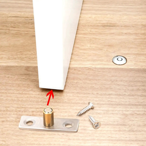 4 Pack Sliding Barn Door Floor Guides With Copper Stainless Steel Rollers And Base Includes 8 Screws Bottom Guide Locators For Glass And Wood Doors Durable Hardware For Smooth Sliding And Stable Door Alignment shown installed with screws.