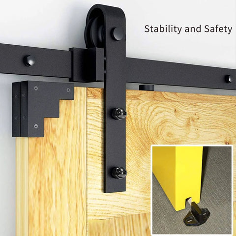 Close-up of wood slab door on 10 FT Double Sliding Barn Door Hardware Track Kit with J Shape Hanger, safety features shown.