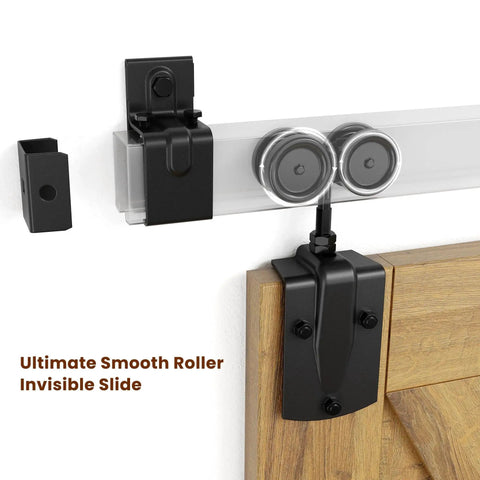 Close-up of the mounting bracket and rollers from the 7 Foot Box Rail Barn Door Hardware Kit For Exterior And Interior Doors Sliding Heavy Duty Wall Mount Kit Easy To Install Fits Doors Up To 42 Inch Wide Includes 5 Track Brackets Zinc Plated Finish Has Corrosion Resistance And Supports Up To 450 Pounds fitted on a wooden door.