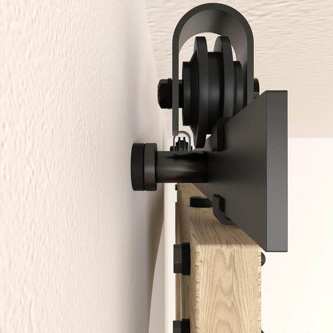 Side view close-up of 6.6FT Barn Door Hardware Kit with Heavy Duty Modular Sliding Track, J Shaped Carbon Steel System installation