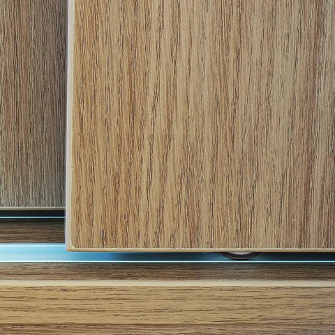 Close-up view of 4 Pieces Barn Door Kit With Sliding Door Rollers And Track Wheels For Wardrobe Cupboard Cabinets including bottom pulley