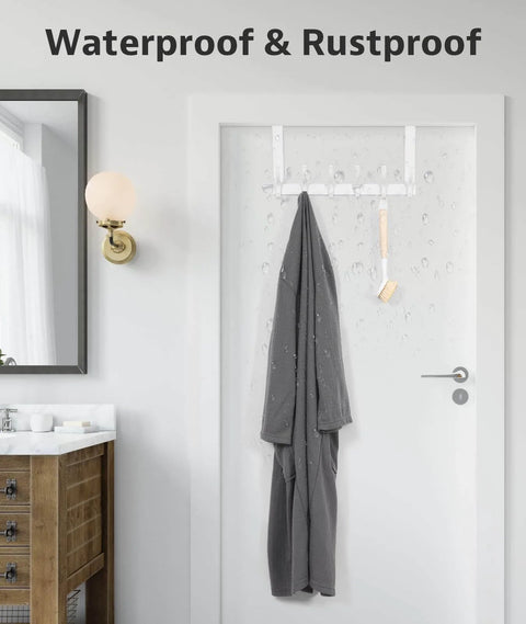 Bathroom door with waterproof and rustproof over-the-door rack holding wet towel and brush